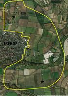 Das Foto zeigt ein Satellitenbild auf dem ein Teil der Ortslage von Trebur zu sehen ist. Östlich von Trebur ist ein Gebiet durch eine gelbe Linie markiert. Die Markierung zeigt das Untersuchungsgebiet für die Faunakartierung.